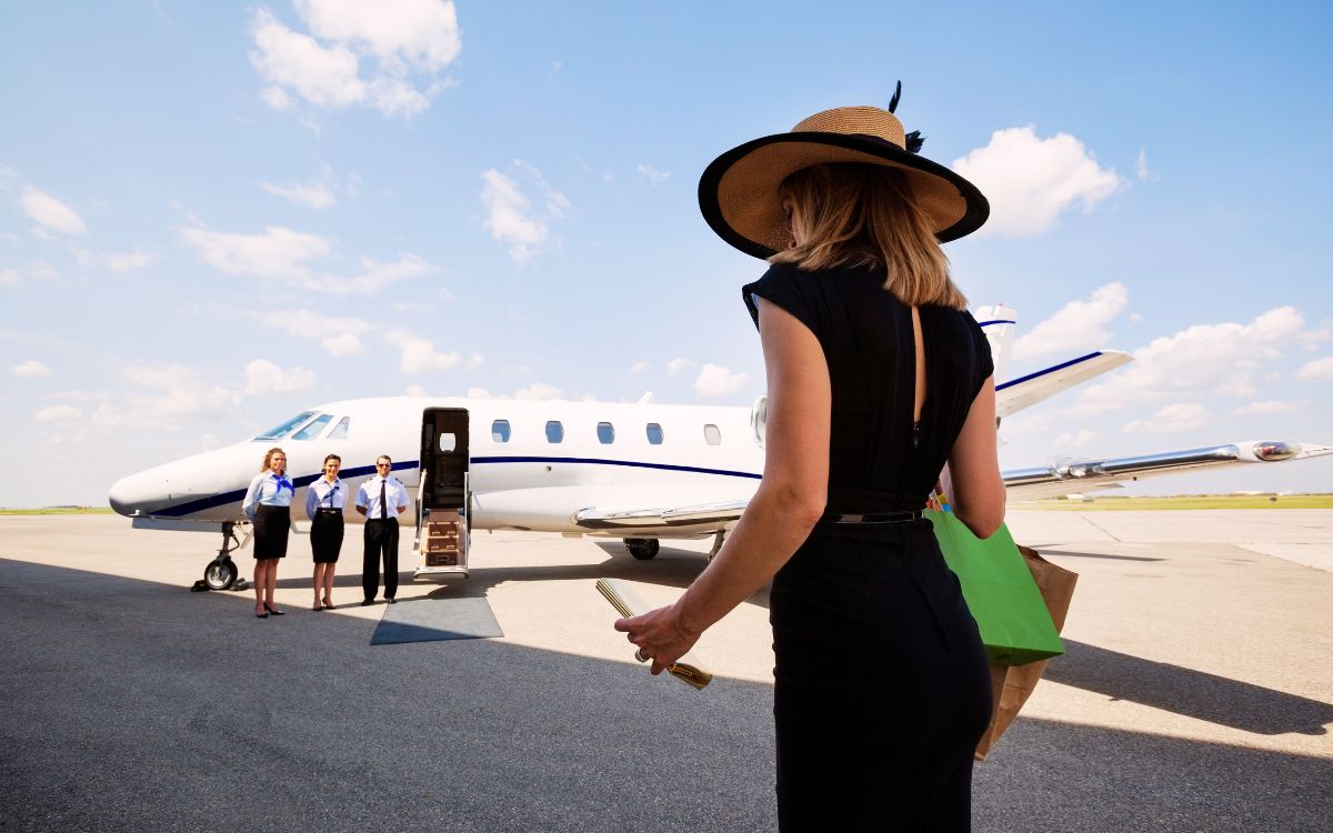 Luxury private jet charter prepared for a dual business and leisure mission on a private FBO tarmac